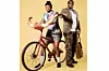 Lutho and Chuma pose for the camera while holding a bicycle.