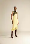 A model wears a Luhkanyo Mdingi olive-green and yellow dress