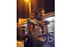 Tiwa Savage and Andrew Yaw Bunting on a bike on the set of \u2018Water and Garri.\u2019