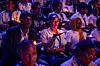 Young Rwandans hold flameless candles while taking part on a vigil during the commemorations of the 30th Anniversary of the 1994 Genocide against the Tutsi at the BK Arena in Kigali on April 7, 2024.