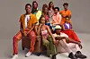 A group portrait of ten young actors from MTV Shuga Mashariki, dressed in vibrant, stylish outfits