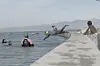 A photo of a person diving into the water in Monwabisi Beach in Cape Town\u2019s Khayelitsha township.