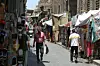 A photo of Al-Moez street in Al-Gamaleya neighborhood next to the Khan Al-Khalili market area in Cairo, Egypt.