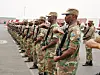 ​South African troops, serving as peacekeepers with the African Union Mission in Burundi salute the arrival of Major General Siphiwe Nyanda, chief of the South African National Defence Force, Bujumbura, Burundi, 27th August 2003