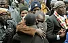 Pictured: Gambian community members comfort each other as they mourn those lost in the Jan 9th Bronx fire
