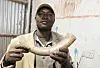 holding elephant tusk