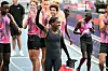 Kenya's Faith Kipyegon (C) reacts at the end of her race after taking part in the 'Breaking4' event, in an attempt to become the first woman to run a mile in under four minutes, at Stade Charlety on June 26, 2025 in Paris.