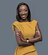Usher Komugisha, a Ugandan sports analyst and journalist, wearing a mustard dress and folding her arms.