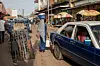 Local people are seen among the shops as daily life continues in Bissau, the capital of Guinea-Bissau on October 05, 2023.