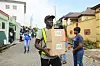 ​Volunteers prepare to transport packed boxes of food and other relief materials to the site for distribution for those in need at Ikotun Egbe, in Alimosho Community area of Lagos State on June 7, 2020.