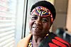 A headshot of Inkosi Theresa Kachindamoto wearing a colorful beaded headband
